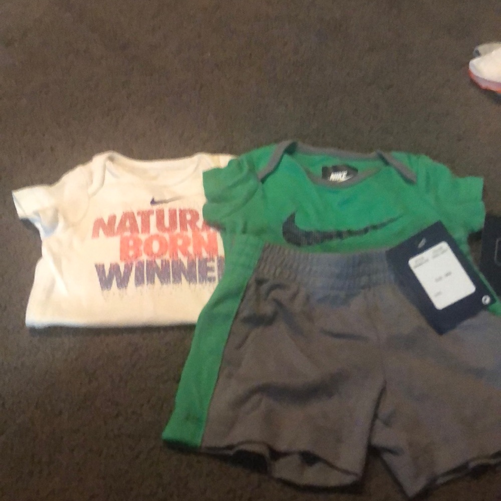1 Nike set and 1 Nike onesie